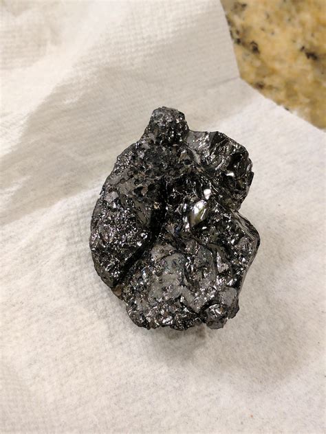 Found Shiny Black Rock On The Beach In South Florida Any Ideas