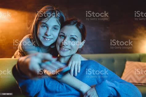 Mother And Daughter Watching Tv Stock Photo Download Image Now