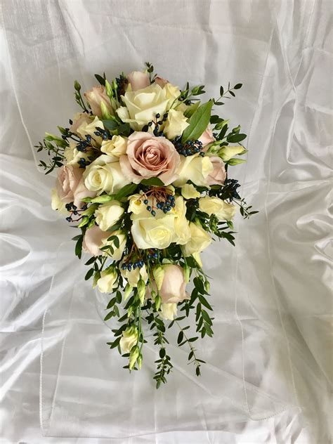 A Bridal Bouquet On A White Sheet