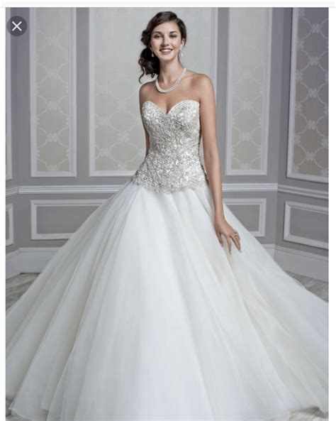 1) low messy bun has loose curls pinned into a bun with some height in the front. Kenneth Winston '1597' size 2 used wedding dress front view on model | Wedding dresses, Ceremony ...