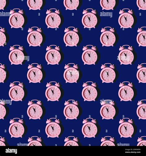 Seamless Pattern With Pink Clocks On A Dark Blue Background Repeating