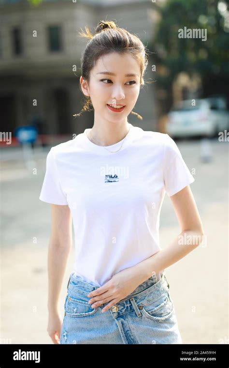 Chinese Actress Qiao Xin Also Known As Bridgette Qiao Poses Before