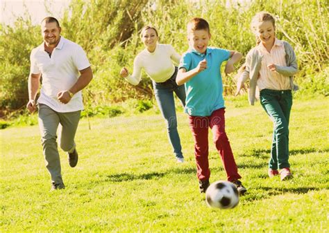 Young Parents Two Children Playing Soccer Stock Photos Free And Royalty
