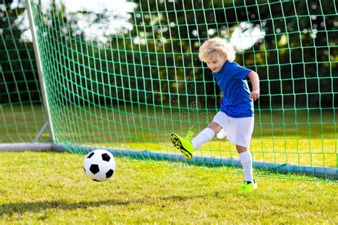 Kids Play Football Child At Soccer Field Stock Photo Image Of Action