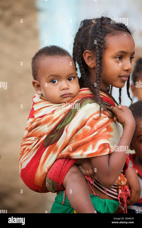 Ethiopian Girl Carrying Baby Brother Aksum Tigray Ethiopia Stock