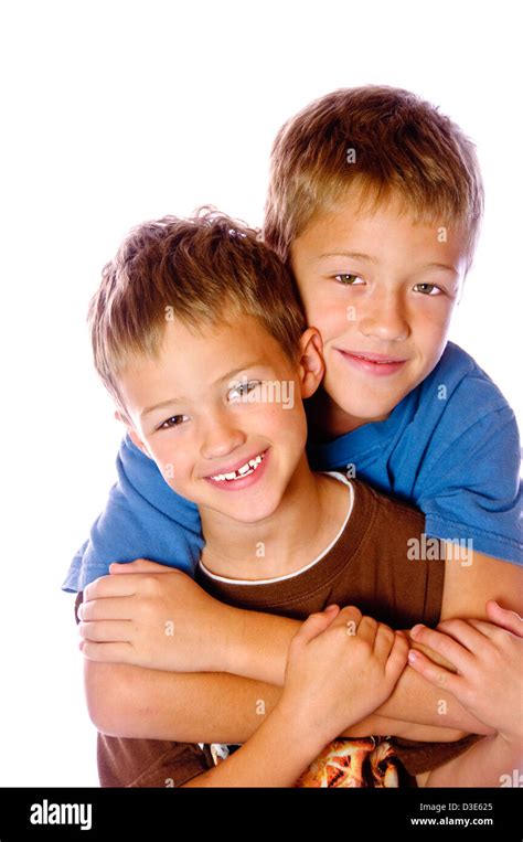 Two Young Boys Hugging Each Other Very Happy Isolated On White Stock