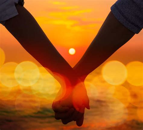 Couple Holding Hands Sunset