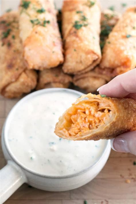 Cook chicken breast and shred. Blue Cheese Buffalo Chicken Egg Rolls - Cake 'n Knife