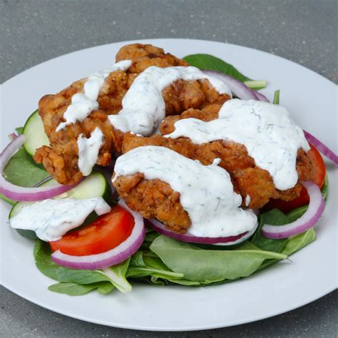Add cheese, tomato, and cucumber to lettuce. Buttermilk-fried Chicken Salad Recipe by Tasty
