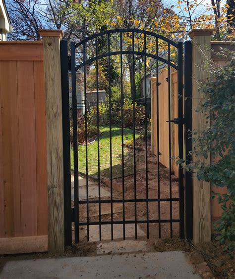The gate will use hinges so that it can swing. Gates/Hardware/Post Caps - Expert Fence in Alexandria Virginia