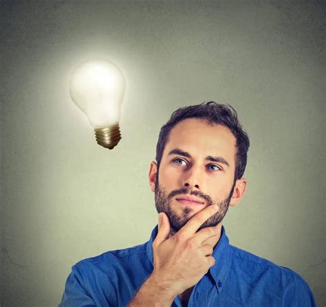Man Looking Up With Dollar Idea Light Bulb Above Head Stock Photo By