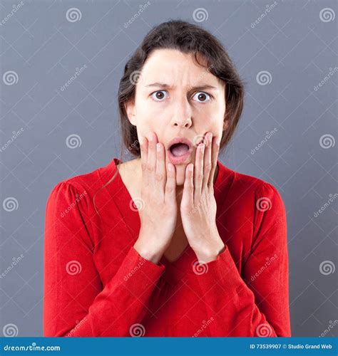 Dumbstruck Young Woman With Jaw Dropping Expression Touching Her Face