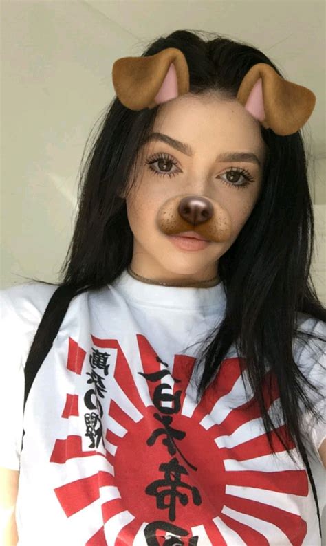 Sitting on sofa in room decorated for christmas holidays and drinking milk at home. On Pinterest @ kitkatlovekesha ♡ ♡ Pin: Snapchat ~ Dog ...