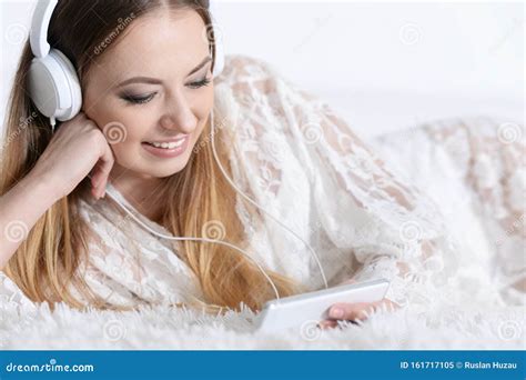 Close Up Portrait Of Young Beautiful Woman Listening To Music Stock