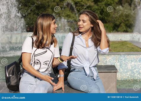 Two Young Adult Women Talking To Each Other Having Emotional