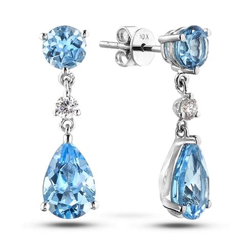 Carat Tw Blue Topaz Canadian Diamond Tear Drop Earrings In White