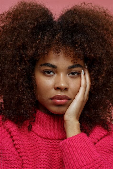 Portrait Of A Young African American Afro Woman In Pink Studio By