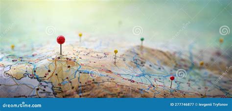 Pins On A Geographic Map Curved Like Mountains Pinning A Location On A