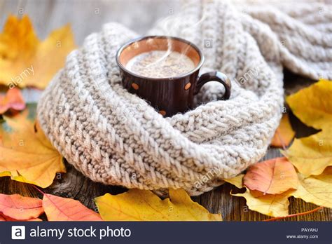 Autumn Leaves Hot Cup Of Coffee And A Warm Scarf On