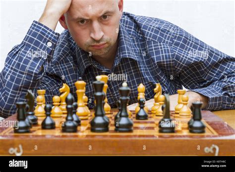 Concentrated Young Man Playing Chess Stock Photo Alamy