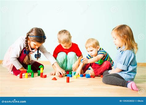 Kids Playing With Wooden Blocks At Kindergarten Stock Photo Image Of