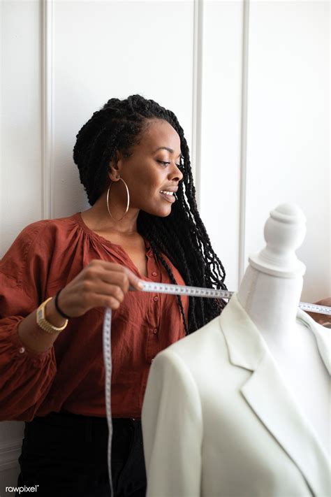 Download Premium Image Of Black Fashion Designer Measuring A White Coat