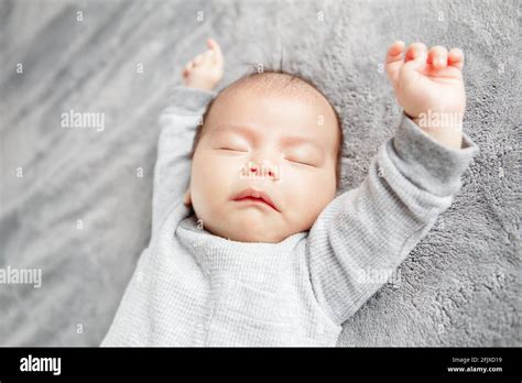 Newborn Baby Touching His Face Hi Res Stock Photography And Images Alamy