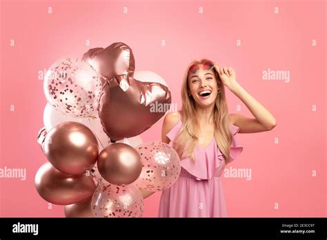 Attractive Cheerful Lady With Holiday Balloons Having Fun On Her
