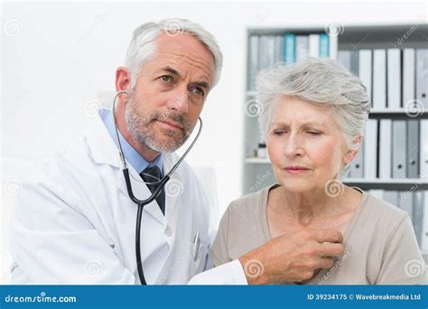 Doctor Checking Patients Heartbeat Using Stethoscope Stock Image