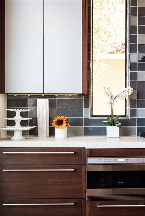 Horizontal wood feed slab doors are an exciting trend, giving for an upscale cabinet design for small kitchen appear, dark wood cabinet doors are a beautiful contrast to lighter countertops, walls and floors. Modern Kitchen with Dark Cabinets - Modern - Kitchen - Los ...