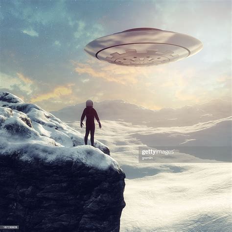 Astronaut On Distant Planet Discovering Ufo High-Res Stock Photo ...