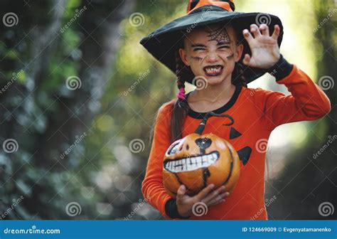 Happy Halloween Horrible Creepy Child Girl In Pumpkin Costume Stock