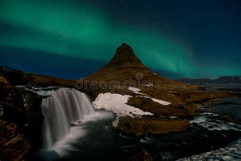 Northern Lights Aurora Borealis Appear Over Mount Kirkjufell In Iceland