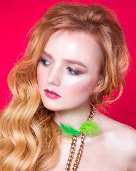 A Beautiful Choker Made Of Gold Chains And Green Fluff Around The Neck