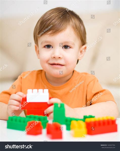 Cute Little Boy Playing Building Blocks Stock Photo 126507704