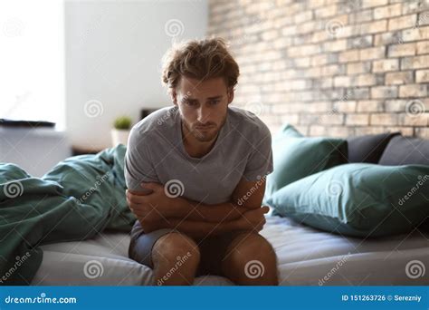 Depressed Young Man Sitting On Bed Stock Photo Image Of Psychological