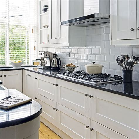 Maybe you would like to learn more about one of these? White kitchen with black worktop | Decorating ...