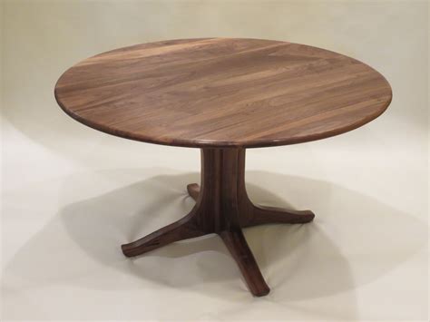 Fashioned on a cast iron pedestal base, the round pine top is braced in a rim of iron to connote progress amidst rustic conditions. Hand Crafted Walnut Pedestal Dining Table by Lost Creek ...