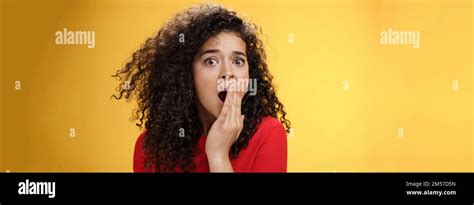 Close Up Shot Of Concerned And Shocked Worried Woman With Curly