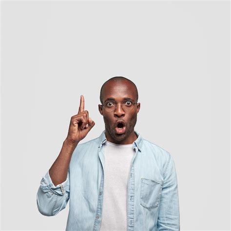 Free Photo Shocked Dark Skinned Guy Looks With Stupefied Expression