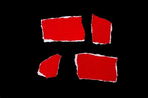 Premium Photo Red Torn Paper Pieces Isolated On Black Background
