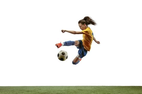 Premium Photo Female Soccer Player Kicking Ball At The Stadium
