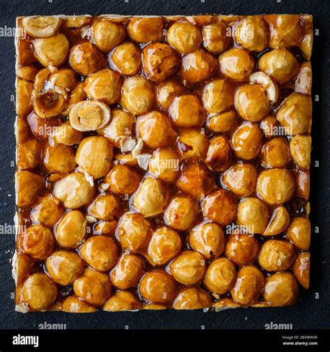 Directly Above Shot Of Hazelnut Brittle On Black Background Stock Photo