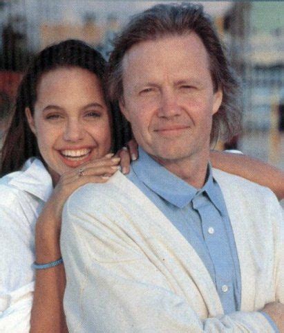 The director stunned on the red carpet at the dga theater for her. Angelina Jolie, sitting on her father Jon Voight's knee as ...