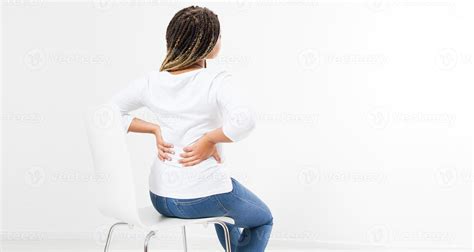 Beautiful Woman Suffering From Backache On Chair Back View Female