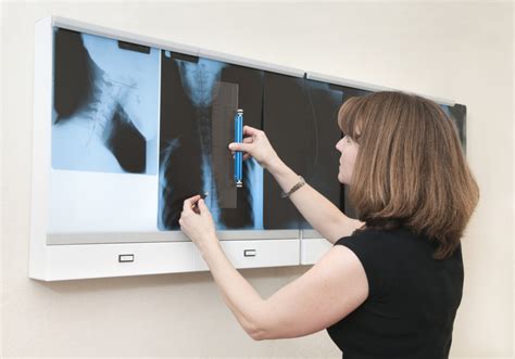 Chiropractor Reviewing Patient X Rays For Treatment Parker University