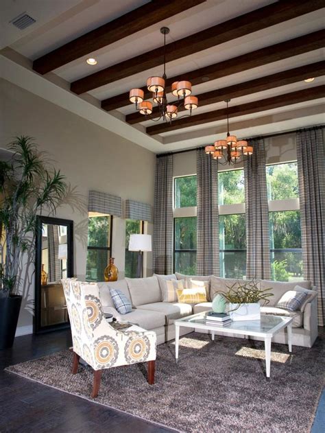 Wooden Beams Add A Cozy Factor To This Stunning Living Room With High Ceilings Floor To
