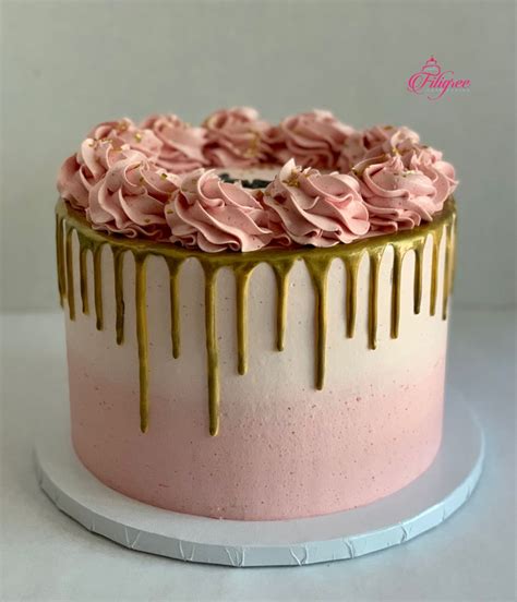 pink and gold drip cake with rosettes cake frosting designs buttercream cake designs