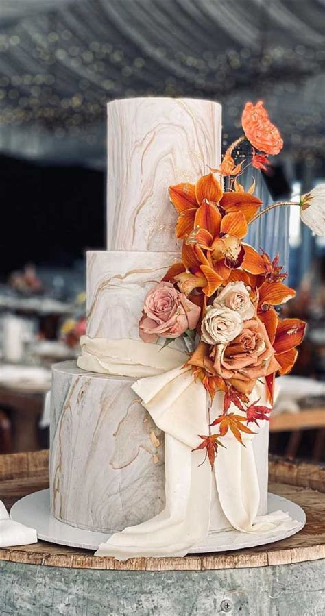 40 pretty and new wedding cake trends 2021 marble wedding cake with rust colored flowers