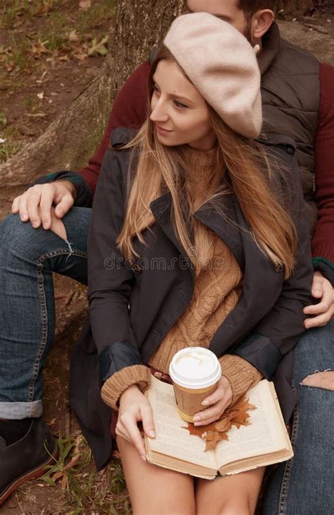 Romantic Couple Drinking Coffee Relaxing In The Park In Autumn Stock
